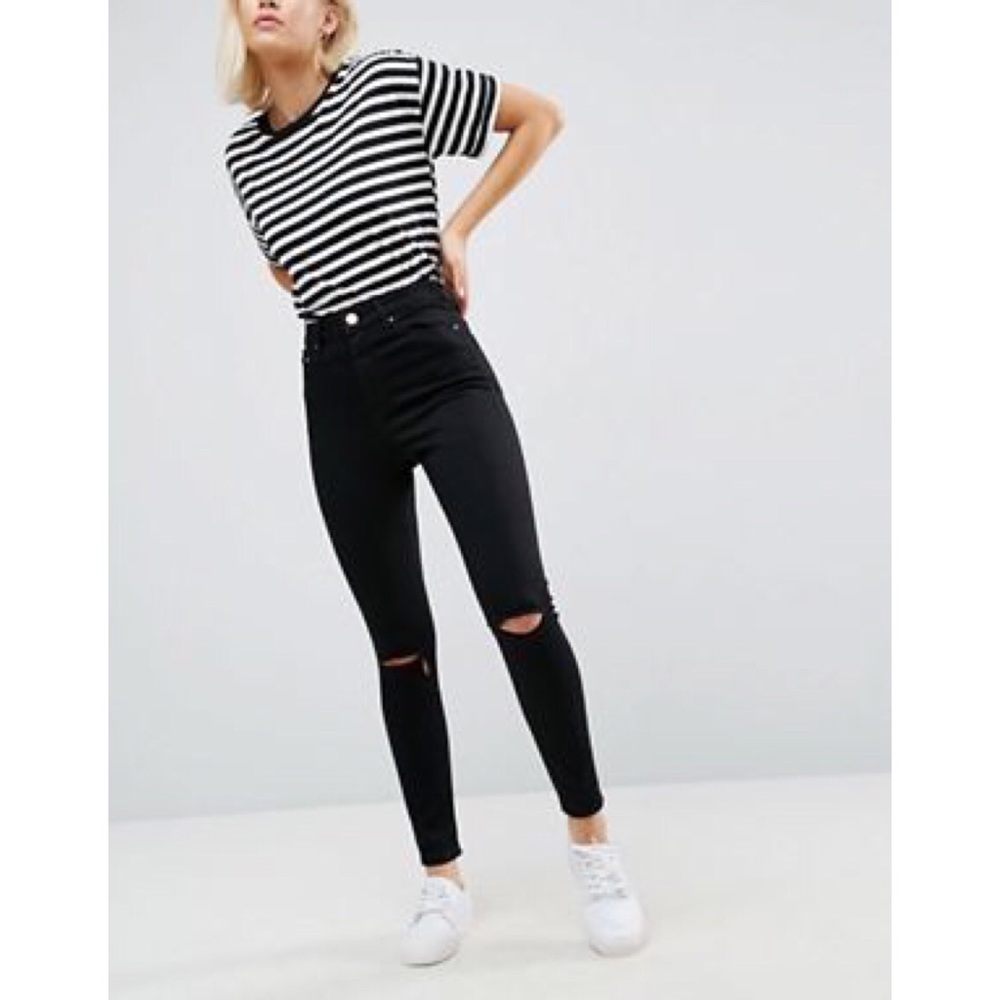 Black high waist skinny jeans with knee slits